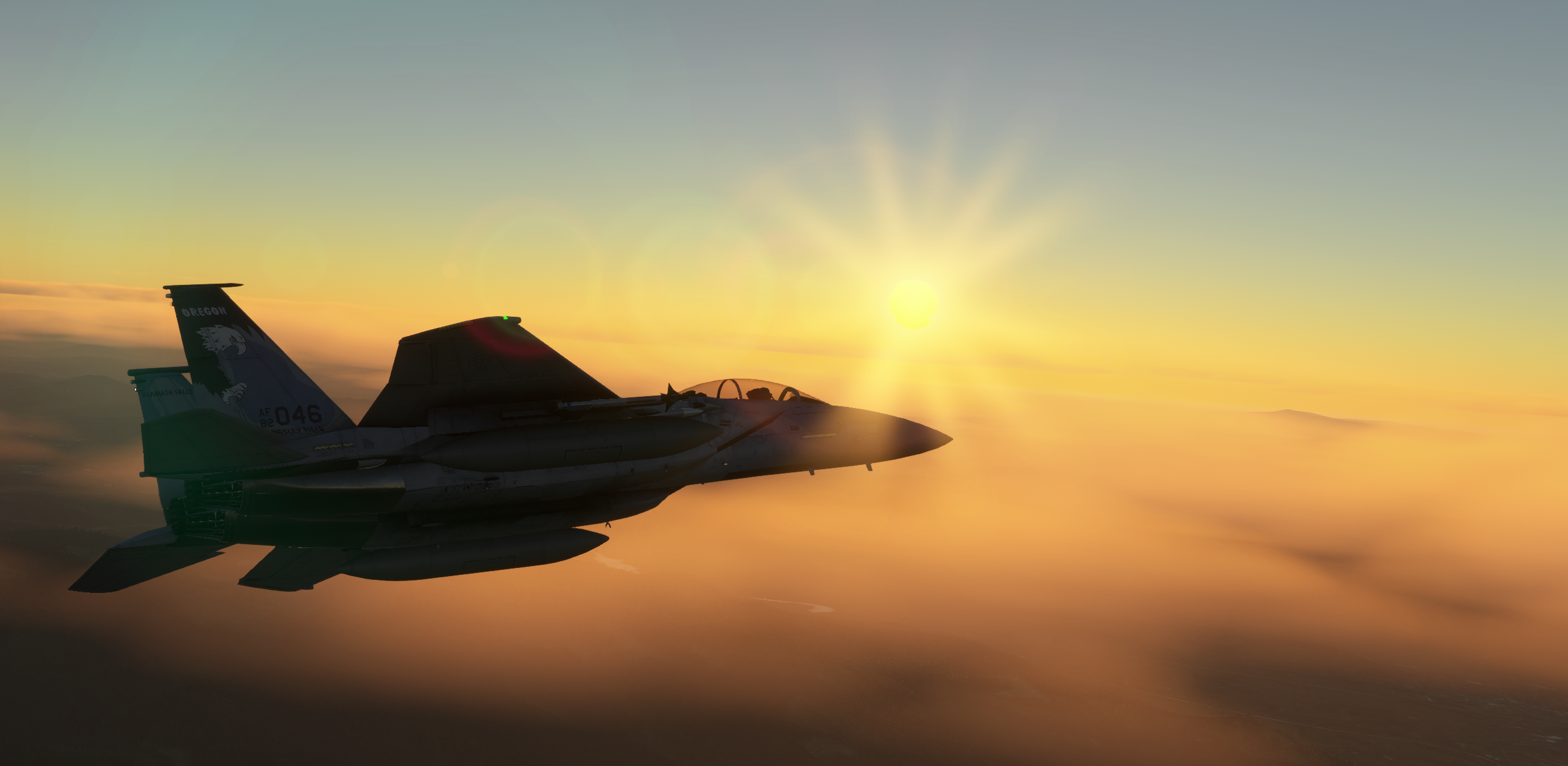 An F-15D in a left turn at sunset