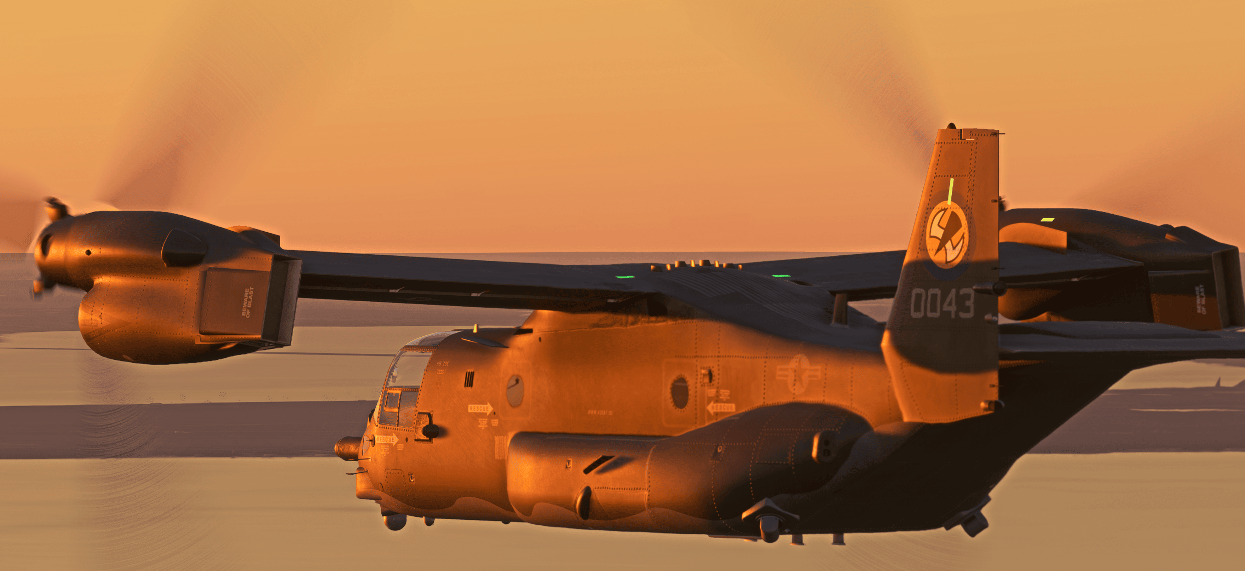 An MV-22 Osprey in flight at sunset